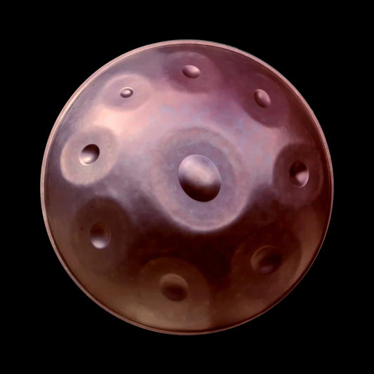 a close up of a metal object on a black background