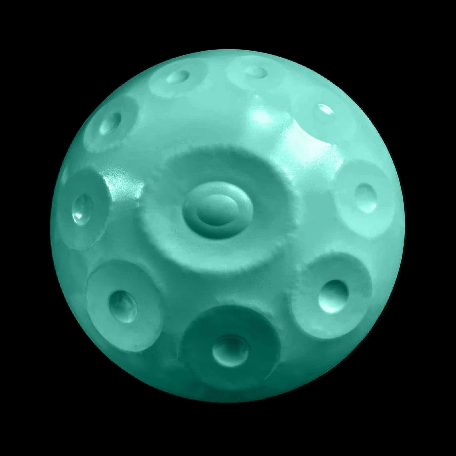 a blue ball with holes in it on a black background