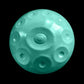 a blue ball with holes in it on a black background