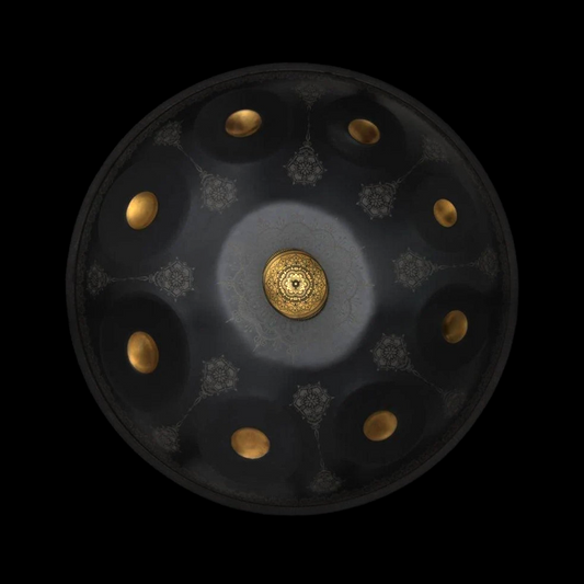 a black and gold plate with gold dots