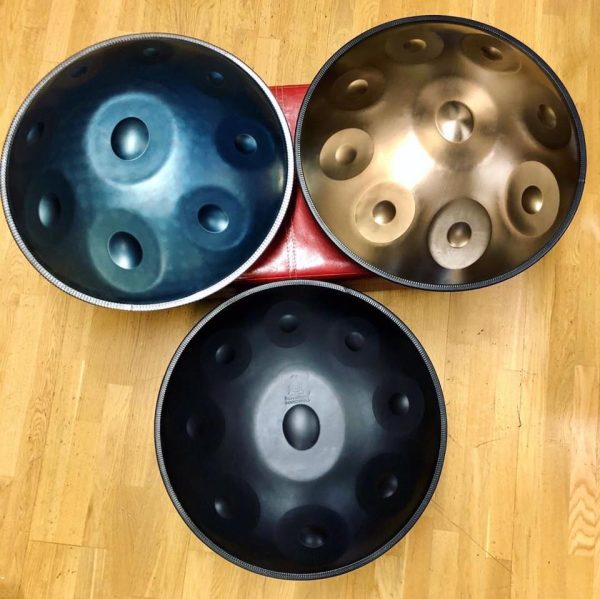 NovaPans Handpans' Generation 4 Handpan in Nitrided Steel in Bluem Gold, and Black.